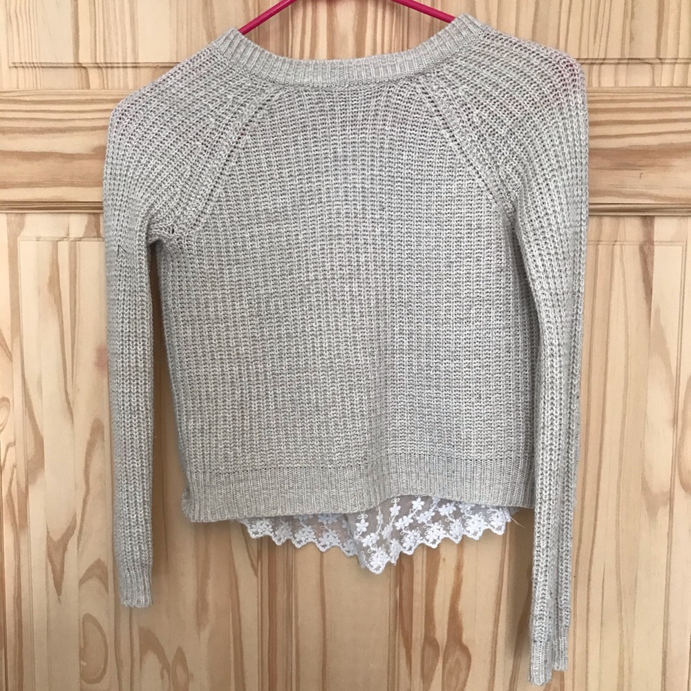 Knit sweater with lace back.